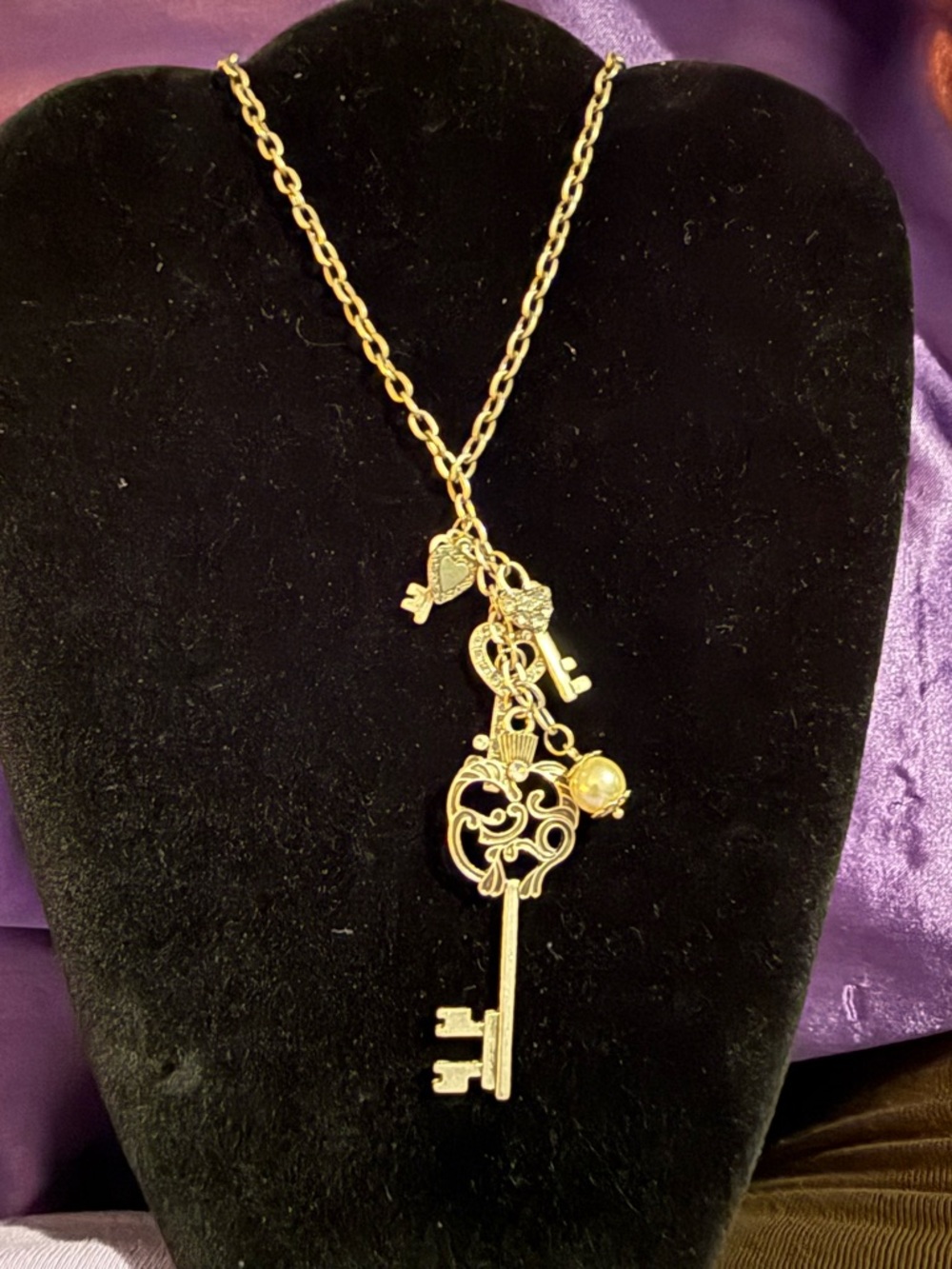 Silver tone Key Pendant Necklace with Charm Accents
